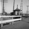 1953c-HwBoro-Train-Crossing-Louellen-HwRR-REL-01-Guard-Shed-east