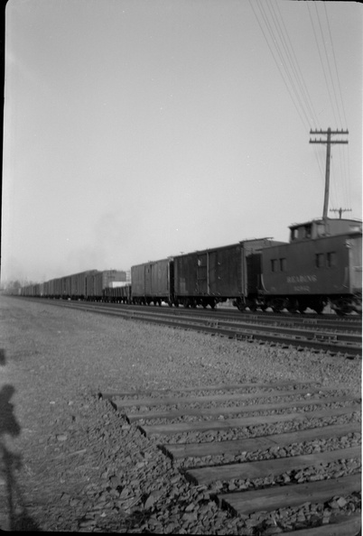 1953c-HwBoro-Train-Crossing-Louellen-HwRR-REL-05-Train-Caboose-east.jpg